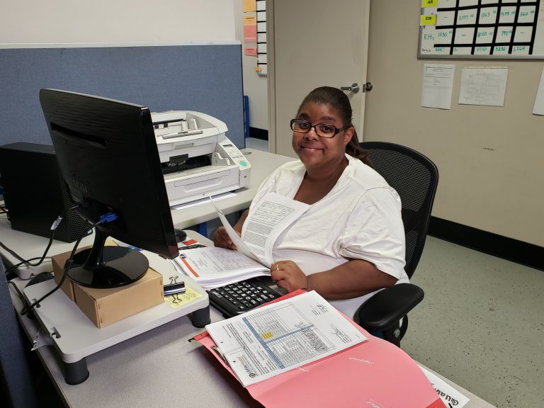 A women working on computer at Eggleston Document Scanning & Conversion Center